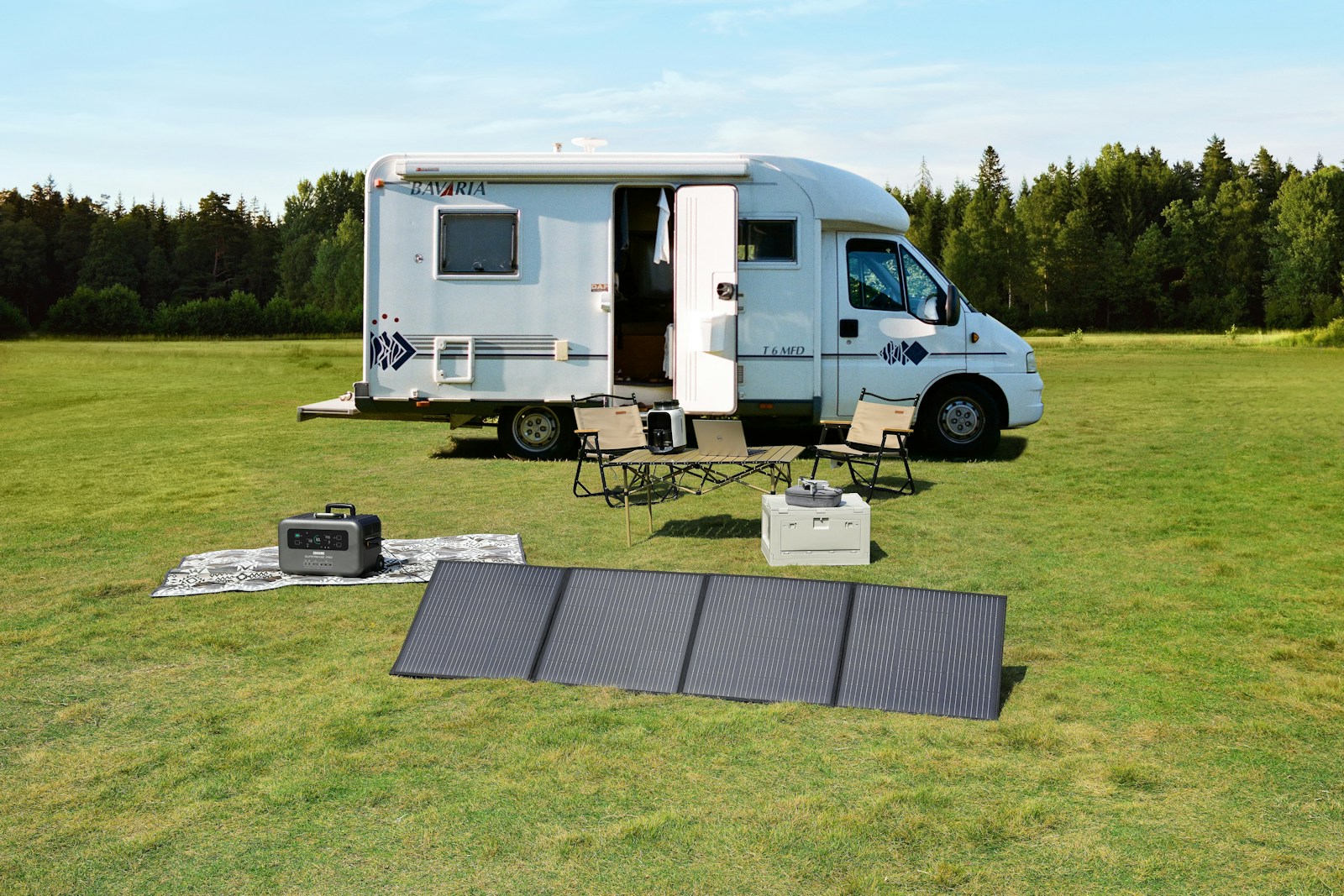 a food truck parked in a field with a solar panel on the ground